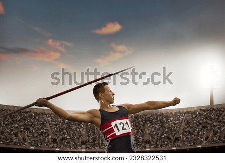 Track and field athlete throwing javelin Royalty-Free Stock Photo #2328322531