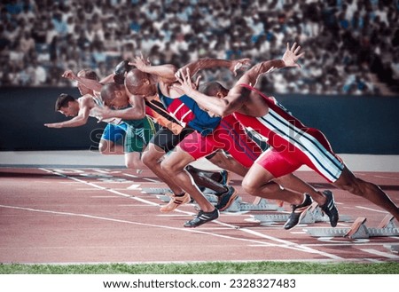 Runners taking off from starting blocks on track Royalty-Free Stock Photo #2328327483
