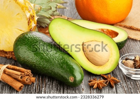sliced avocado on wood background