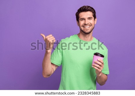 Photo of funny young advertiser promo picture guy coffee takeaway morning teatime point finger mockup isolated on violet background