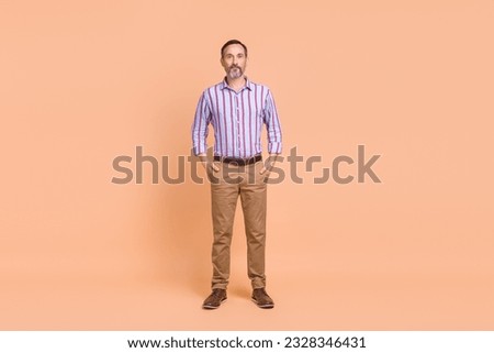 Full length photo of serious person with gray beard dressed colorful shirt standing arms in pockets isolated on pastel color background