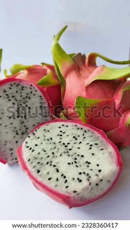 Dragon fruit is a sweet fruit. There are insects inside that can be eaten. The bark is red, inside is white.