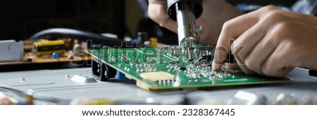 
electronic technician,banner, hands repairing electronic devices The use of modern one-stop service center concepts. Royalty-Free Stock Photo #2328367445