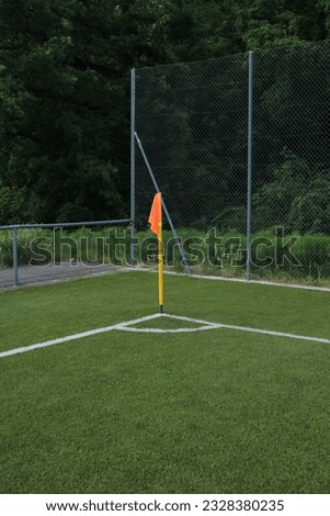 Orange corner flag on a soccer field