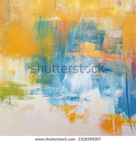 Yellow, blue and white painting textured surface close-up. Oil paint on a canvas abstract background. Happy mood in an art piece created by bright colors and wide brush strokes