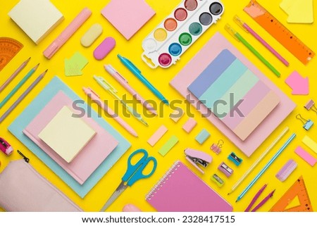 Flat lay with colorful school stationery on color backgroung, top view
