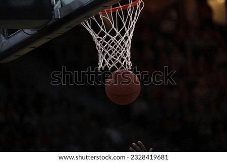 Basketball down the hoop in a match