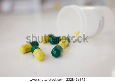 Pills, medication and capsules of pharmaceutical drugs on table for cure, pain or remedy at the clinic. Closeup of healthcare or medical tablets on desk at pharmacy for products, dose or inventory