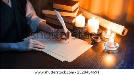 Close up top view past god biblical law mail notice page pray read space. Closeup age male arm hold nib inkwell scribe draw art diary teach notepad card author human man boy dark black wood desk table Royalty-Free Stock Photo #2328454691