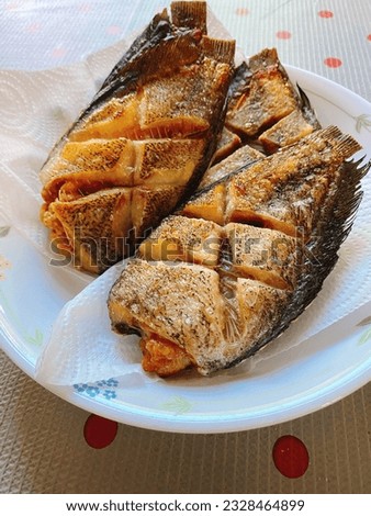a dish of fried fishes