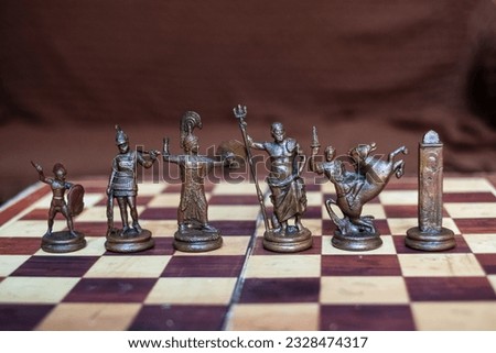 Antique metal made chess pieces based on Greek Mythological Characters  Royalty-Free Stock Photo #2328474317