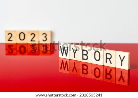 Polish white and red colors and the word WYBORY in Polish for the parliamentary elections and the year 2023, The concept of elections in Poland Royalty-Free Stock Photo #2328505241