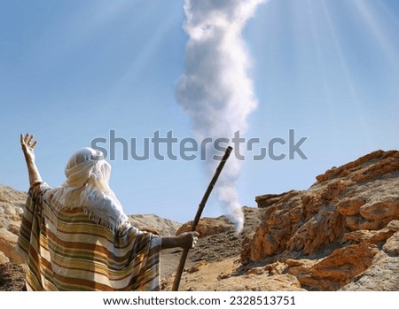 Retro holy Jesus Christ adult age egypt wise saint male human rise arm back light cloudy view. Middle east jew robe cloth Lord law torah story magic israelite hold wooden wand rod cane symbol concept Royalty-Free Stock Photo #2328513751