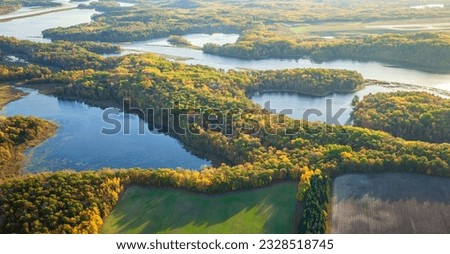 Aerial view of the Mississippi River and farm fields in northern Minnesota on a bright sunny autumn morning