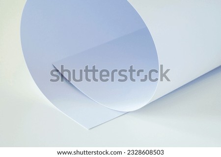 Large white sheet of paper on a white background.