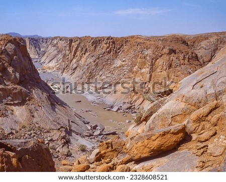 The Orange River Gorge below the waterfall in the Augrabies Falls National Park in the Northern Cape Province of South Africa. Royalty-Free Stock Photo #2328608521