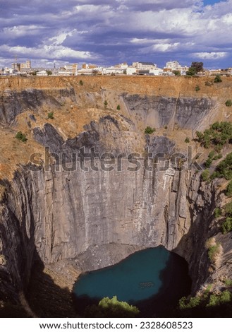 The Big Hole in Kimberley, in the Northern Cape Province of South Africa, is an open-pit and underground mine claimed to be the deepest hole ever excavated by hand. Royalty-Free Stock Photo #2328608523