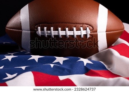 American football ball. American football with American flag. dark background. Team sport concept. copy space. space for text. American football background. America Soccer ball.