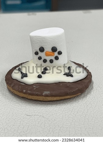 Marshmallow snowman melted by the sweetness of chocolate