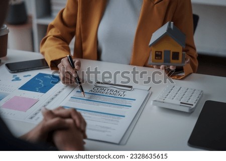 Lawsuits against Real estate agent and realtor general liability insurance businessman professional discussing and consultant with house toy model building before sign a contract with law concept