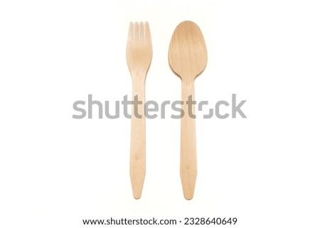 Wooden fork and spoon, isolated background.