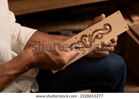 Carpenter working on woodworking tools in carpentry shop. person works in a carpentry shop. woodworker. woodcutting. Royalty-Free Stock Photo #2328653277