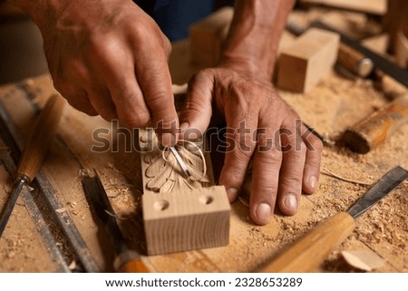 Carpenter working on woodworking tools in carpentry shop. person works in a carpentry shop. woodworker. woodcutting. Royalty-Free Stock Photo #2328653289