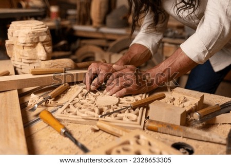 Carpenter working on woodworking tools in carpentry shop. person works in a carpentry shop. woodworker. woodcutting. Royalty-Free Stock Photo #2328653305