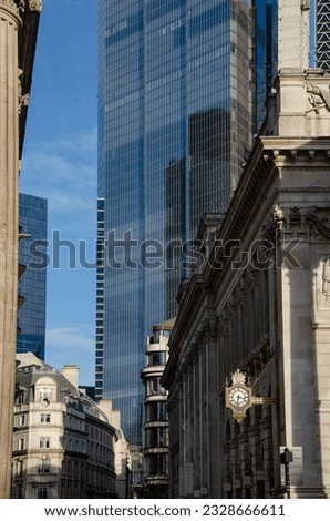 Contrast between old and new buildings in the heart of London on the sunny winter day