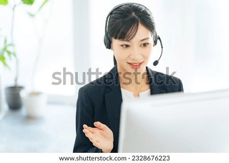 Female operator working in office. Call center. Customer support. Royalty-Free Stock Photo #2328676223