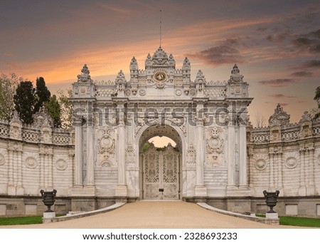 Sunset shot of closed gate leading to former Ottoman Dolmabahce Palace, or Dolmabahce Sarayi, suited in Ciragan Street, Besiktas district, Istanbul, Turkey. View from the internal court Royalty-Free Stock Photo #2328693233