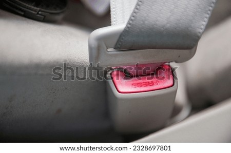 fastened car seat belt, symbolizing safety, responsibility, and protection on the road. A reminder to buckle up for a secure journey Royalty-Free Stock Photo #2328697801