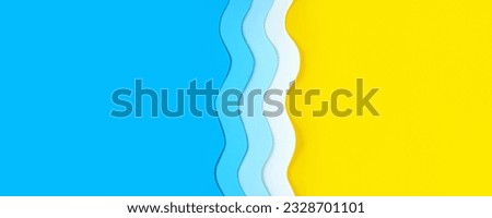 Seaside summer long banner with place for text. Paper cut blue waves on left and yellow beach sand on right. Relaxation and fun on sea resort vacation. The ocean coast background, divided in half. Royalty-Free Stock Photo #2328701101