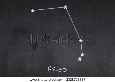 Blackboard with the Aries constellation drawn in the middle. Royalty-Free Stock Photo #2328718989