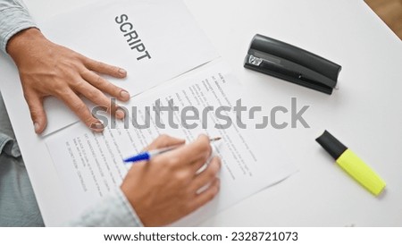 Young caucasian man screenwriter writing script at office Royalty-Free Stock Photo #2328721073