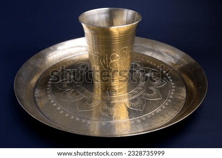decorated, carved bronze Plate for taking meal. once it ws popular serving plate or dish in Bangladesh and indian royal family. food grade kansa plate or thali and glass or water pot.