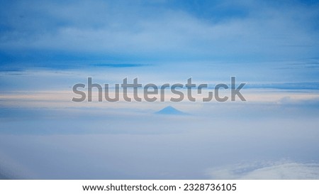 Pictures of the sky and mountains taken from an airplane