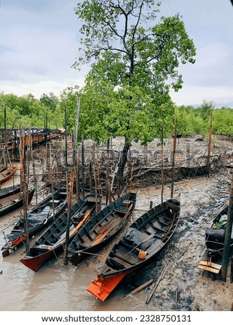 several wooden boats used by fishermen to catch fish 