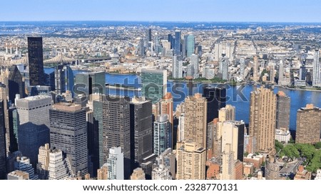 Aerial view of bustling city with high rise skyscraper structure building in New York Manhattan main hub with crowd