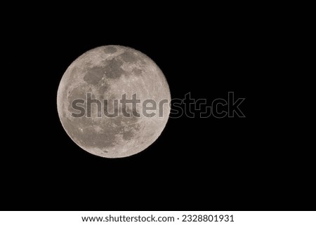 Full Moon whit the visible surface crater in the black dark night background Royalty-Free Stock Photo #2328801931