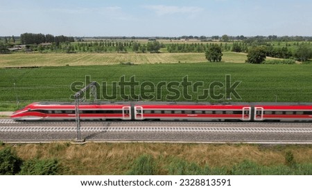 Europe, Italy , Milan - Frecciarossa Hight speed 300km h train raylway from Milano  to Rome view from the drone - the faster way to travel in Italy for tourist and passengers - tourist destination 