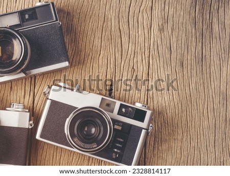 vintage old film camera on wood board with copy space