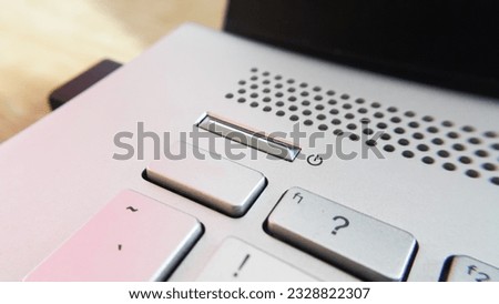 Close up view of power button on computer laptop