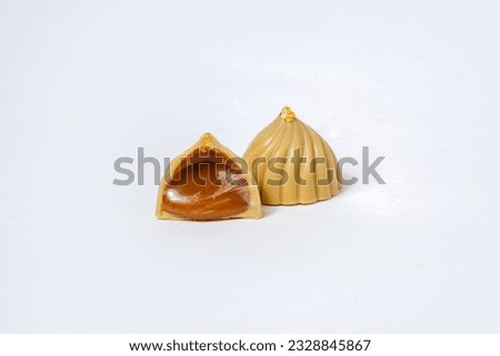 Isolated close up photo of white caramel chocolates cut in half  Royalty-Free Stock Photo #2328845867