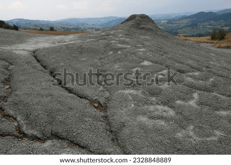 The clay cracked out of the mud and clay volcanos of Regnano (Salsa di Regnano), Albinea, Reggio Emilia, Emilia Romagna, Italy Royalty-Free Stock Photo #2328848889