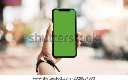 Phone, green screen and person hands in city for social media, advertising and website ui or ux design mockup. Mobile app, technology and people with smartphone space for outdoor or urban travel