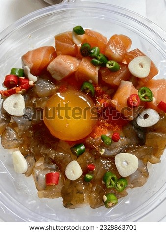 Raw salmon, pickled shrimp, pickled egg yolk sprinkled with fresh chili