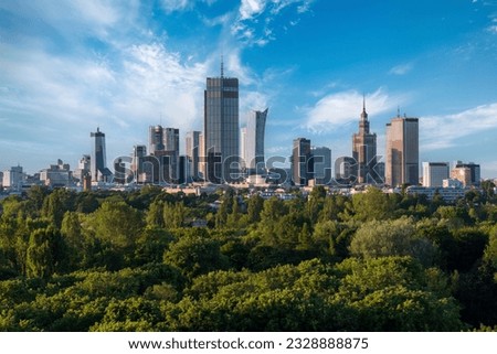 Aerial, drone panorama of Warsaw city during sunset. View from Pole Mokotowskie Park Royalty-Free Stock Photo #2328888875