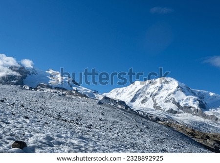 Zermatt, Switzerland - July 2nd: Panoramic view of two peaks of over 4000m: Dufourspitze and Liskamm. Royalty-Free Stock Photo #2328892925