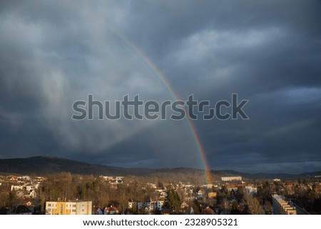 Dramatic rainbow on a rainy day